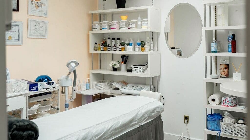 Tranquil treatment room at Beauty World Nyc Queens featuring a massage table and products, New York, New York, US.