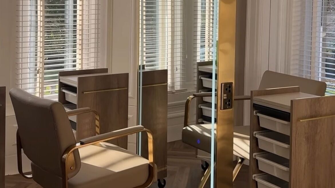 Modern styling station at Islapryce.Hair in Airdrie, Scotland, GB featuring elegant chairs and mirrors.