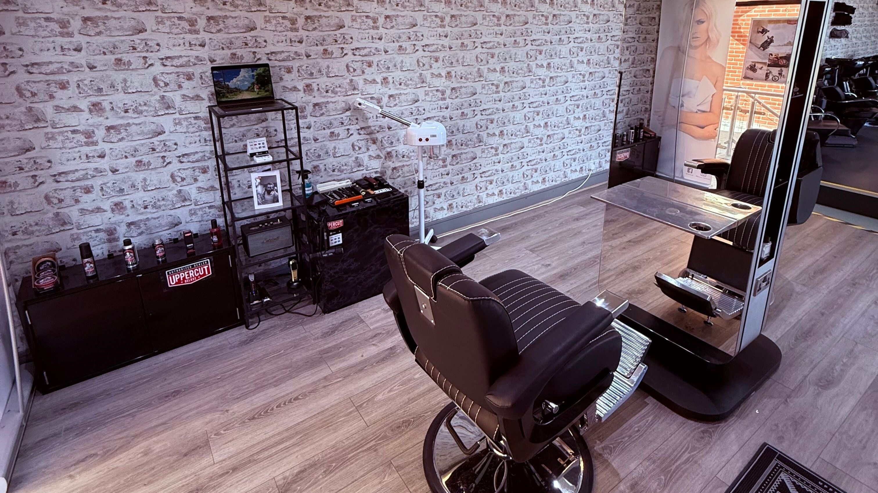 Sleek barber chair in modern setting at Stream Barbers, Eastbourne, England, GB with stylish decor.