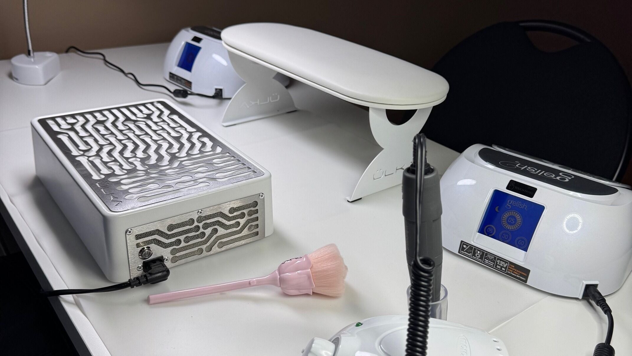 Professional nail tools at IZUMINKA Nails Studio, Coquitlam, British Columbia, CA, showcasing modern equipment.