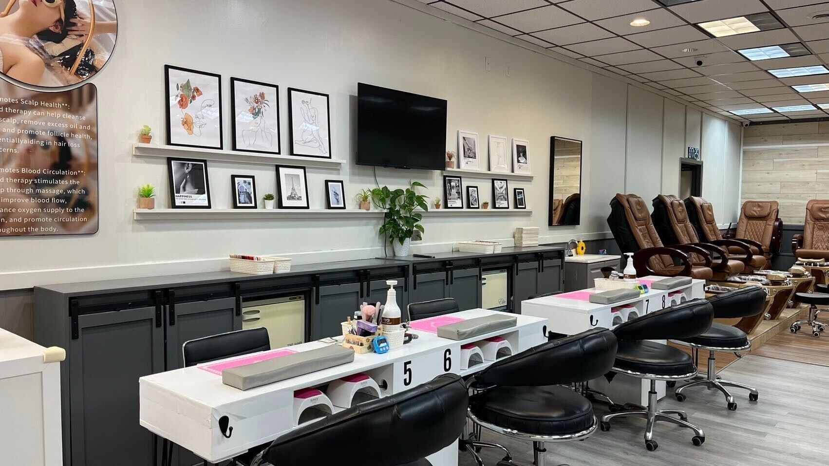 Chic interior of Lee's Nail Salon in Middletown, RI, US showcasing elegant nail stations and comfy pedicure chairs.