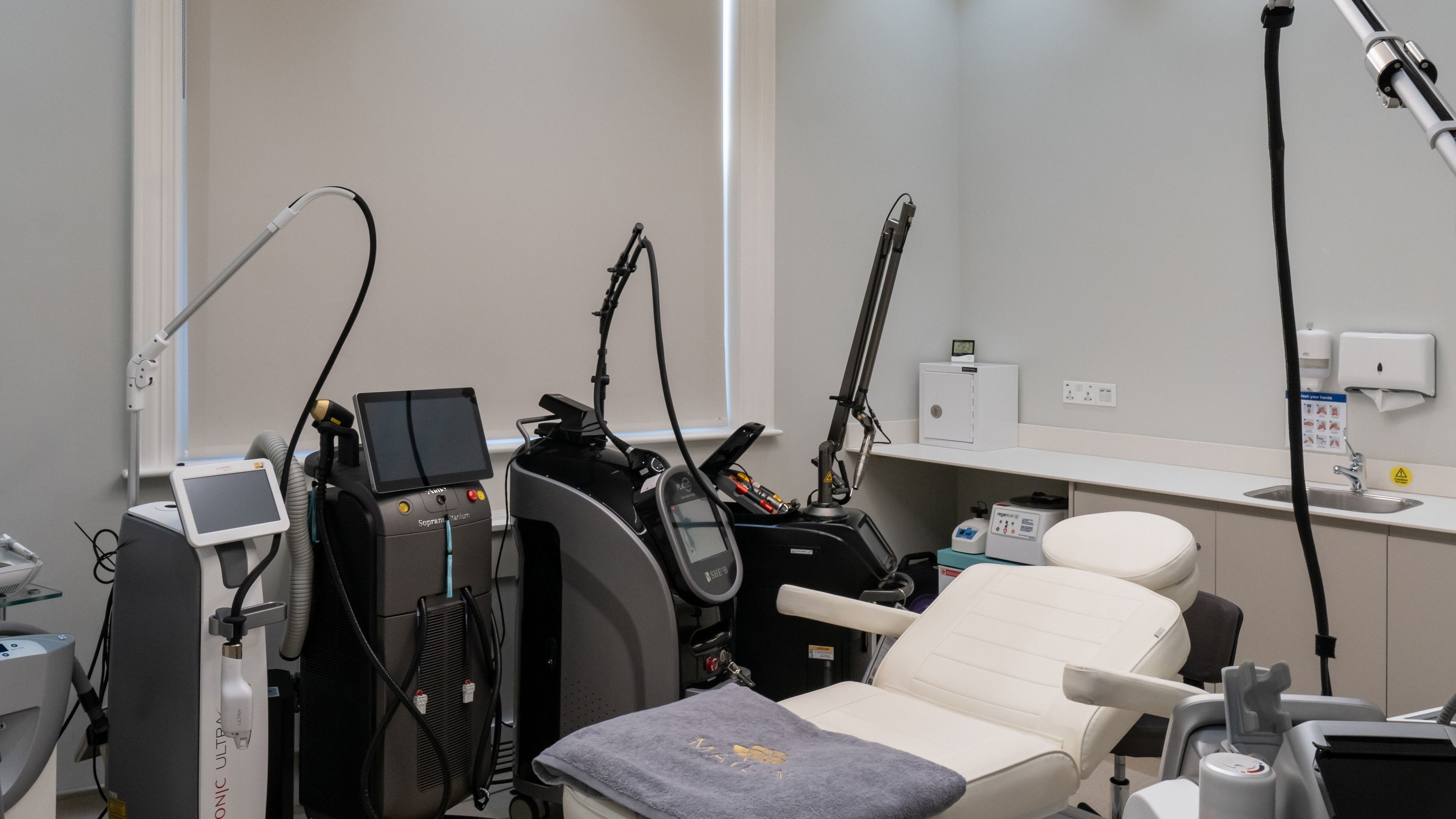Modern treatment room at Skinlab+, London, England, GB with advanced aesthetic equipment.