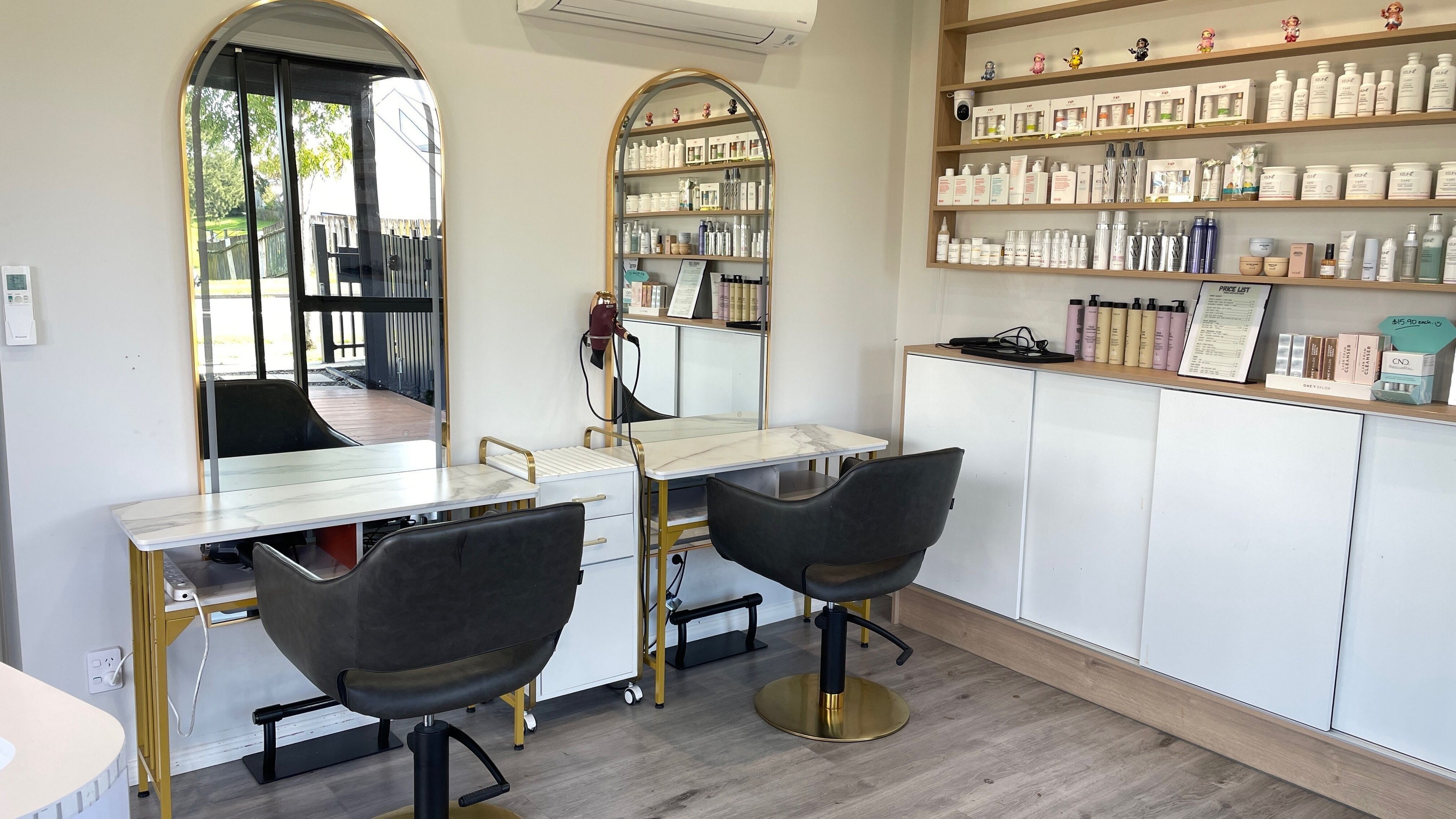 Sophisticated interior of That Beaute Salon, Auckland, NZ, featuring styling stations and premium beauty products.
