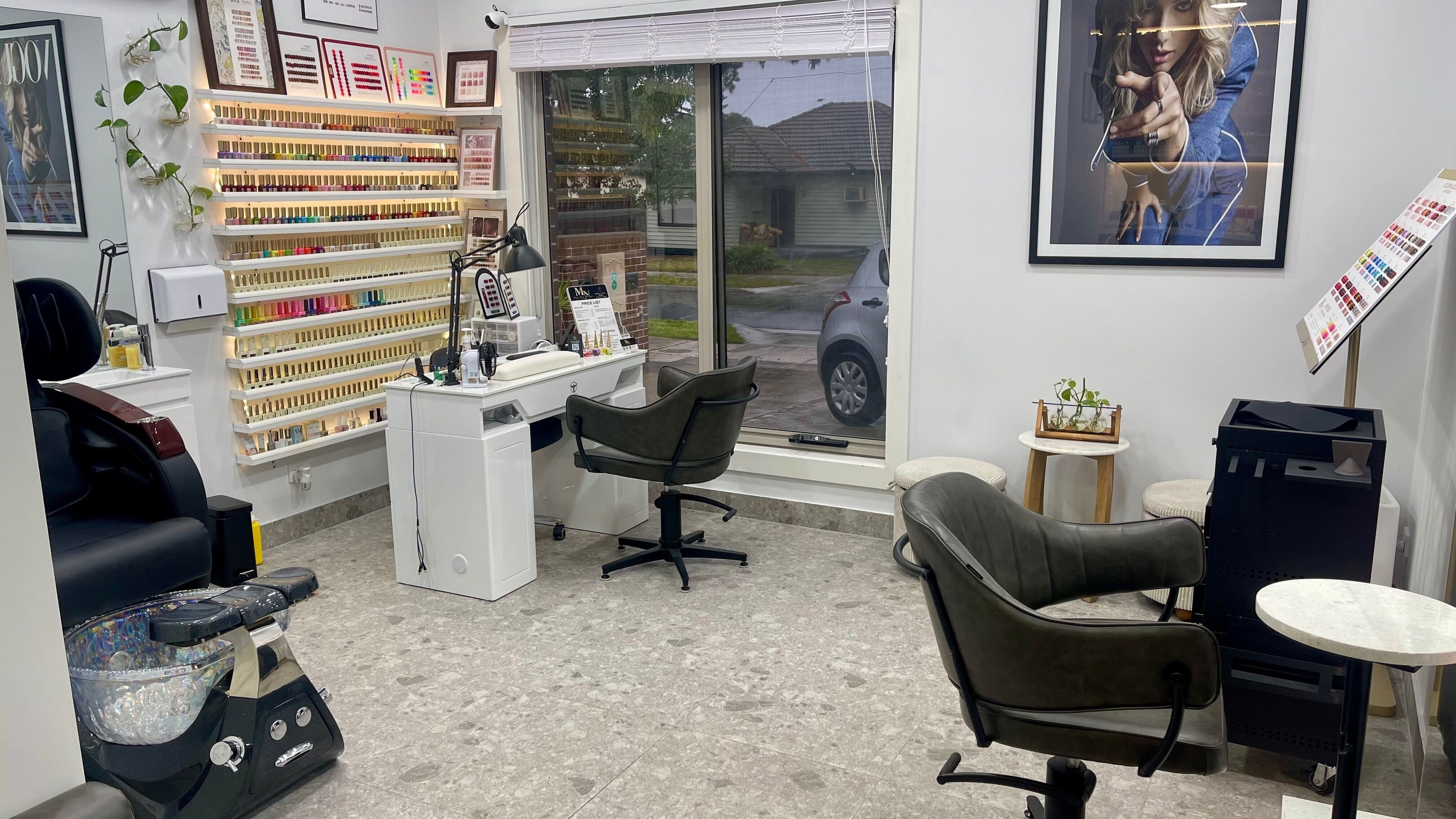 Elegant interior of Garden Nails & Hair Design, Saint Albans, Victoria, AU showcases nail stations and stylish decor.