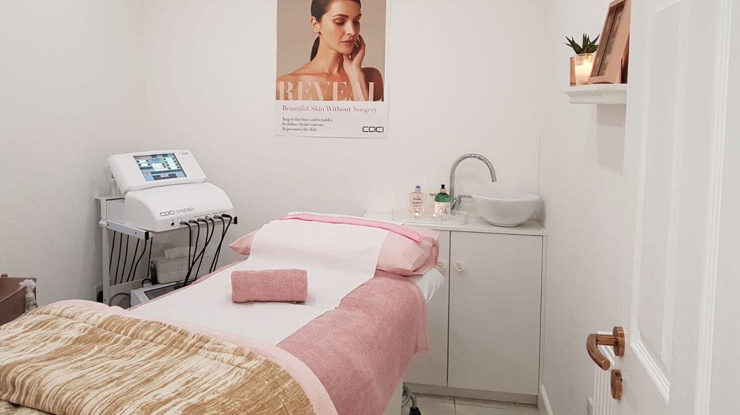 Cozy treatment room at House of Beauty London, England, GB with plush bed, equipment and serene decor.
