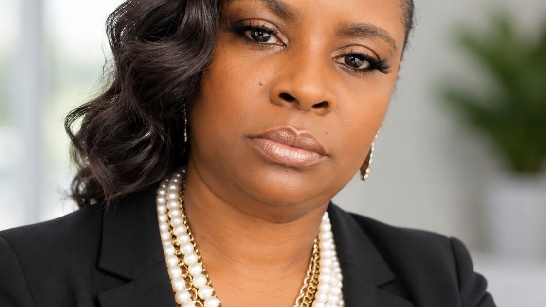 Professional portrait of a stylist with pearls by Dawn By Dezign Mobile Stylist in Houston, Texas, US.