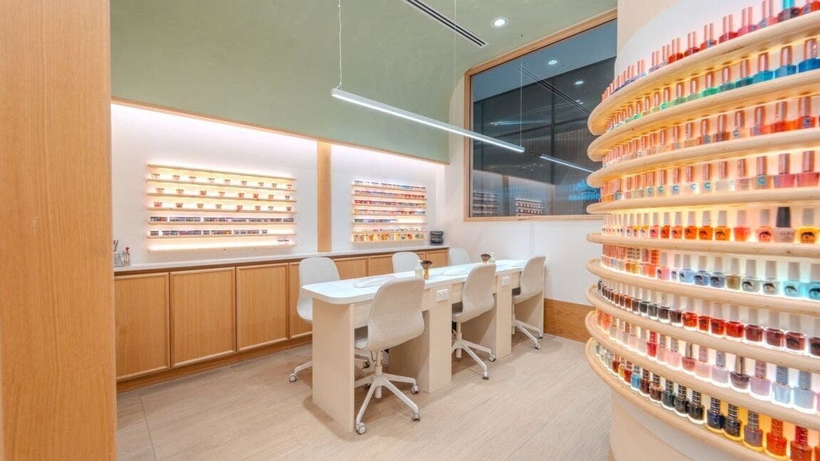 Elegant interior of Soho Nails Chadstone, Melbourne, Victoria, AU with vibrant nail polish displays and seating.