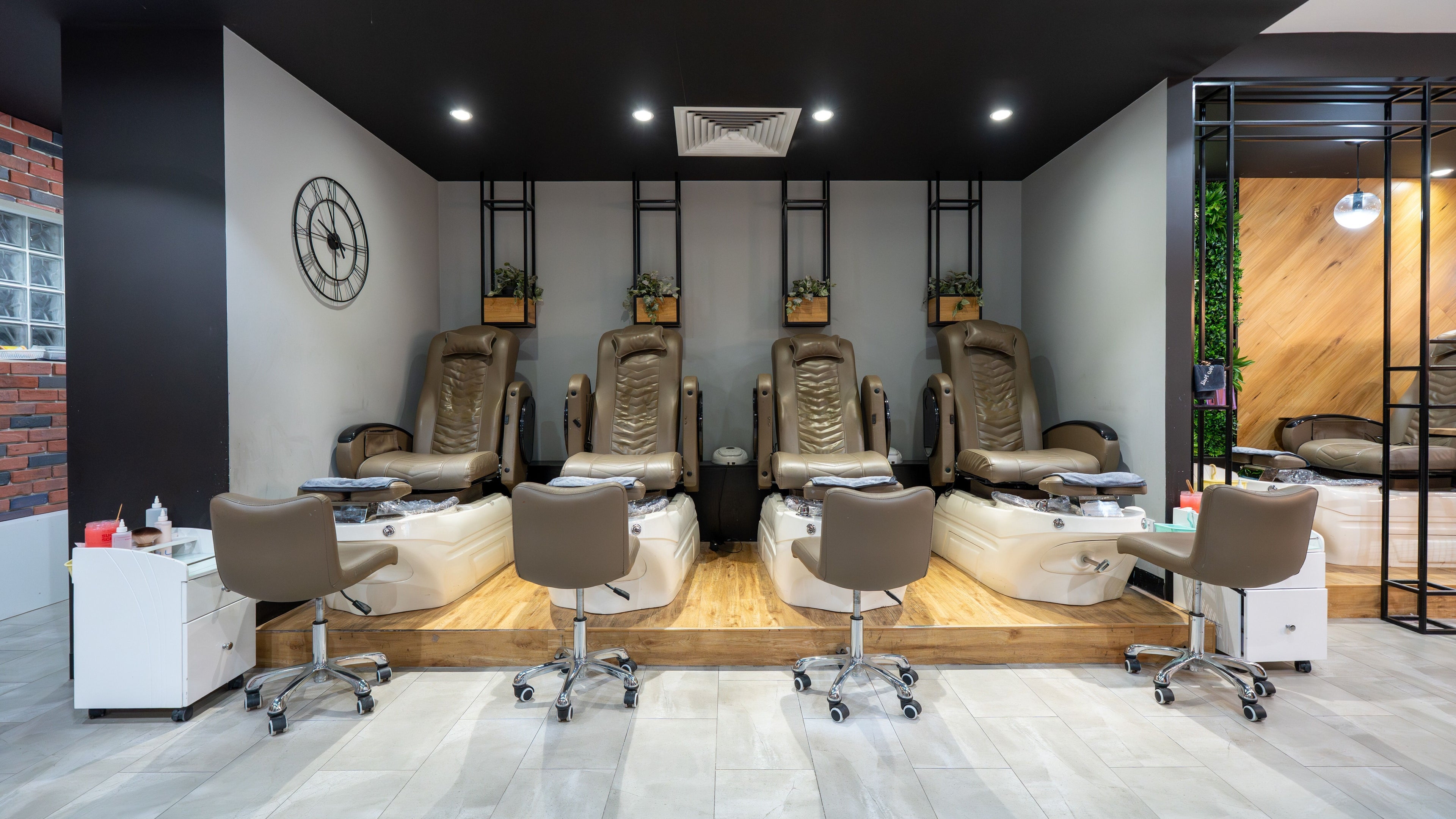 Pedicure chairs at Soho Nails Armadale, Stonnington, Victoria, AU, featuring modern spa facility with plush seating.