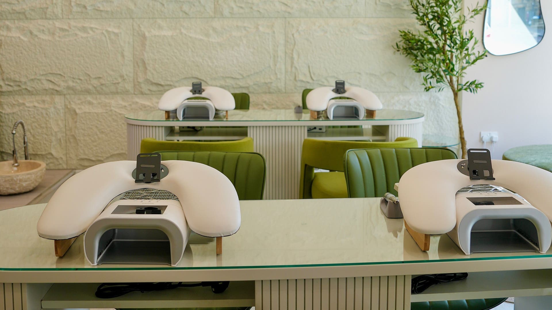 Modern manicure stations at Aida Laser & Beauty, Glasgow, Scotland, GB, showcasing chic design and comfort.