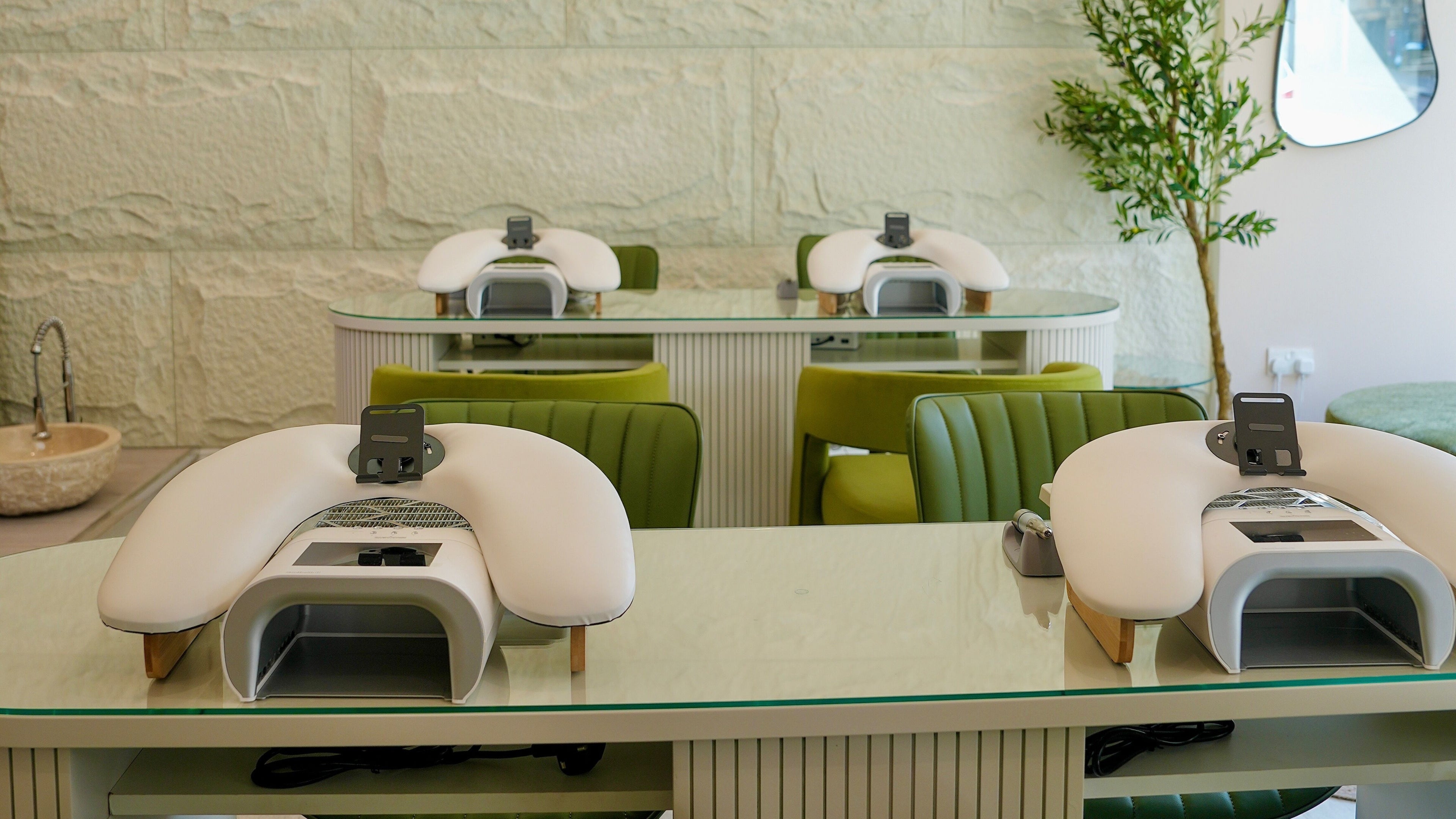 Modern manicure stations at Aida Laser & Beauty, Glasgow, Scotland, GB, showcasing chic design and comfort.