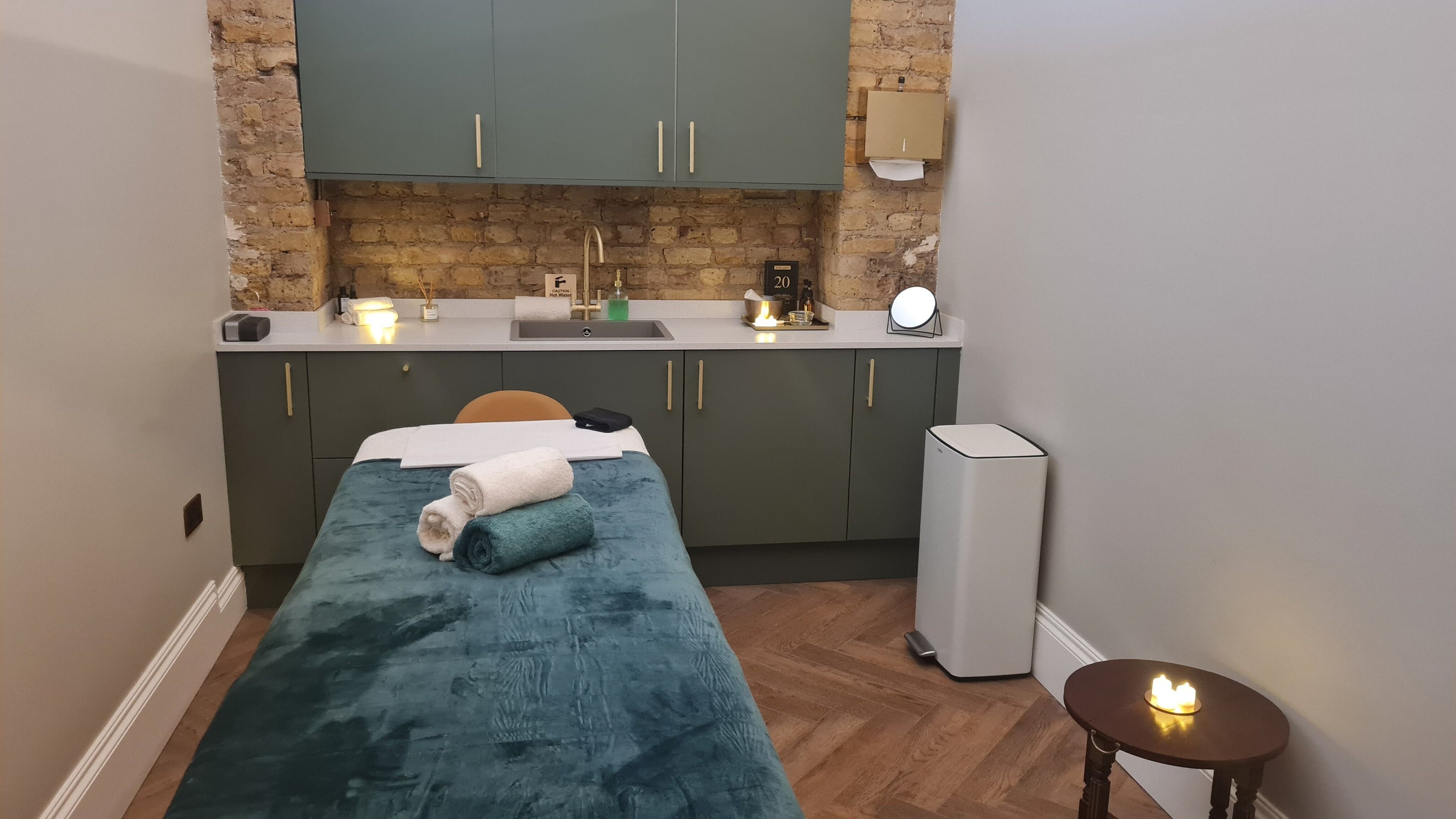 Serene treatment room at EVASION, London, England, GB with cozy setup and calming ambiance.