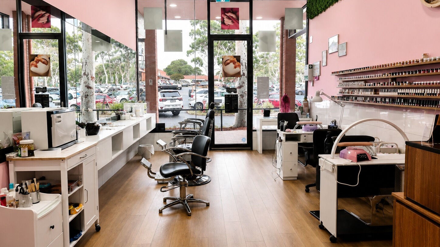 Fleuve Hair Salon's sleek, modern interior in Melbourne, Victoria, AU, highlighting styling stations and nail bar.