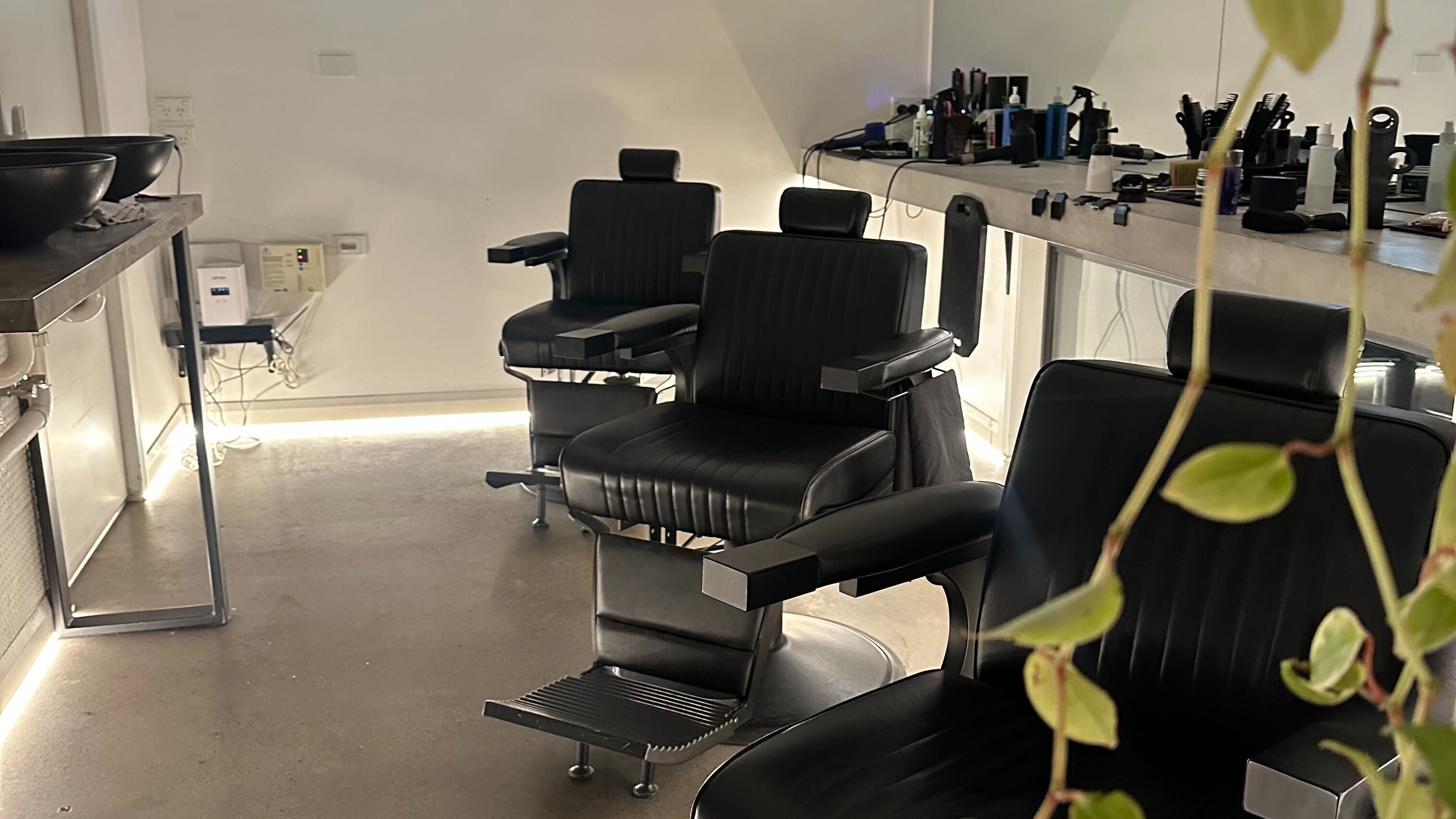 Elegant barber chairs at The Lakeside Barbershop, Melbourne, Victoria, AU, offering stylish grooming services.