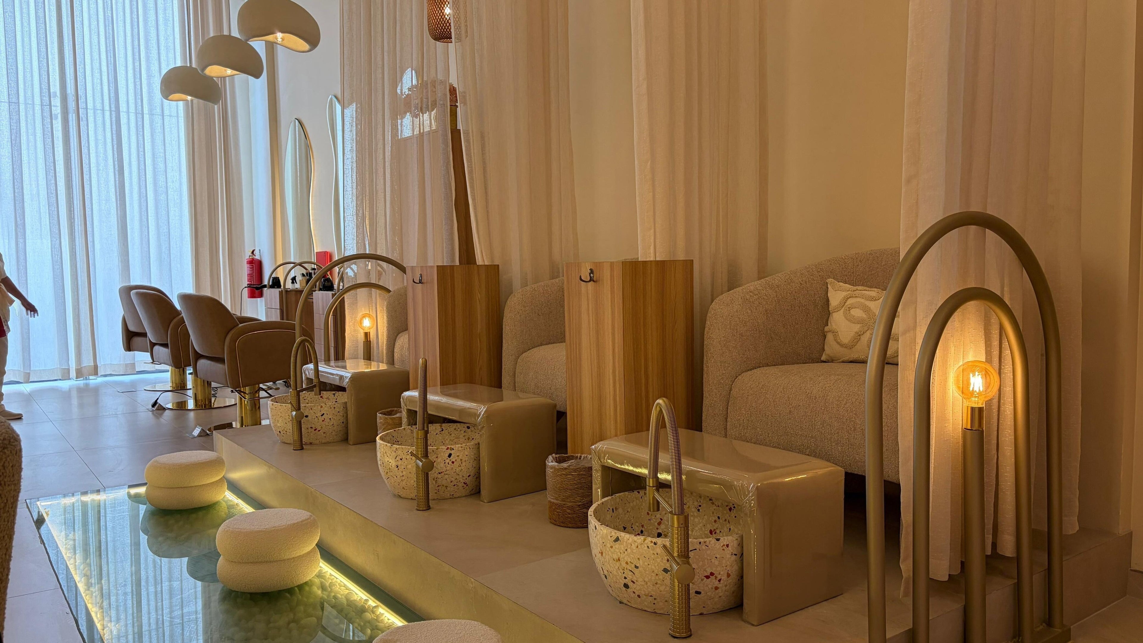 Luxurious pedicure chairs at Oran Beauty Salon & Spa, Riyadh, Riyadh Province, SA showcasing a serene ambiance.
