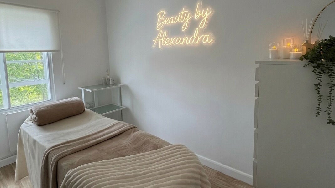 Tranquil treatment room at Beauty by Alexandra, Norwich, England, GB. Features a cozy bed and soothing ambiance.