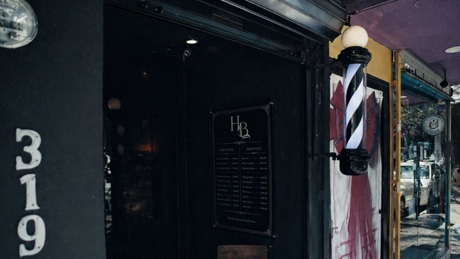 Entrance of HANDSOME & BEAUTIFUL with a barber pole in Puerto Vallarta, Jalisco, MX.