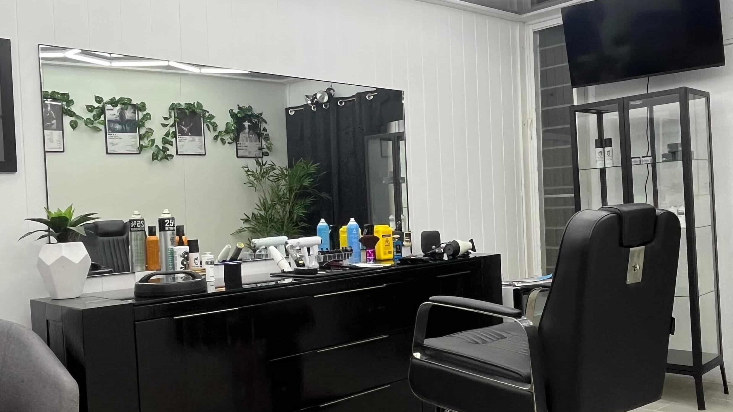 Modern barber station at KoukKutz, Merrylands, New South Wales, AU featuring sleek styling tools and decor.