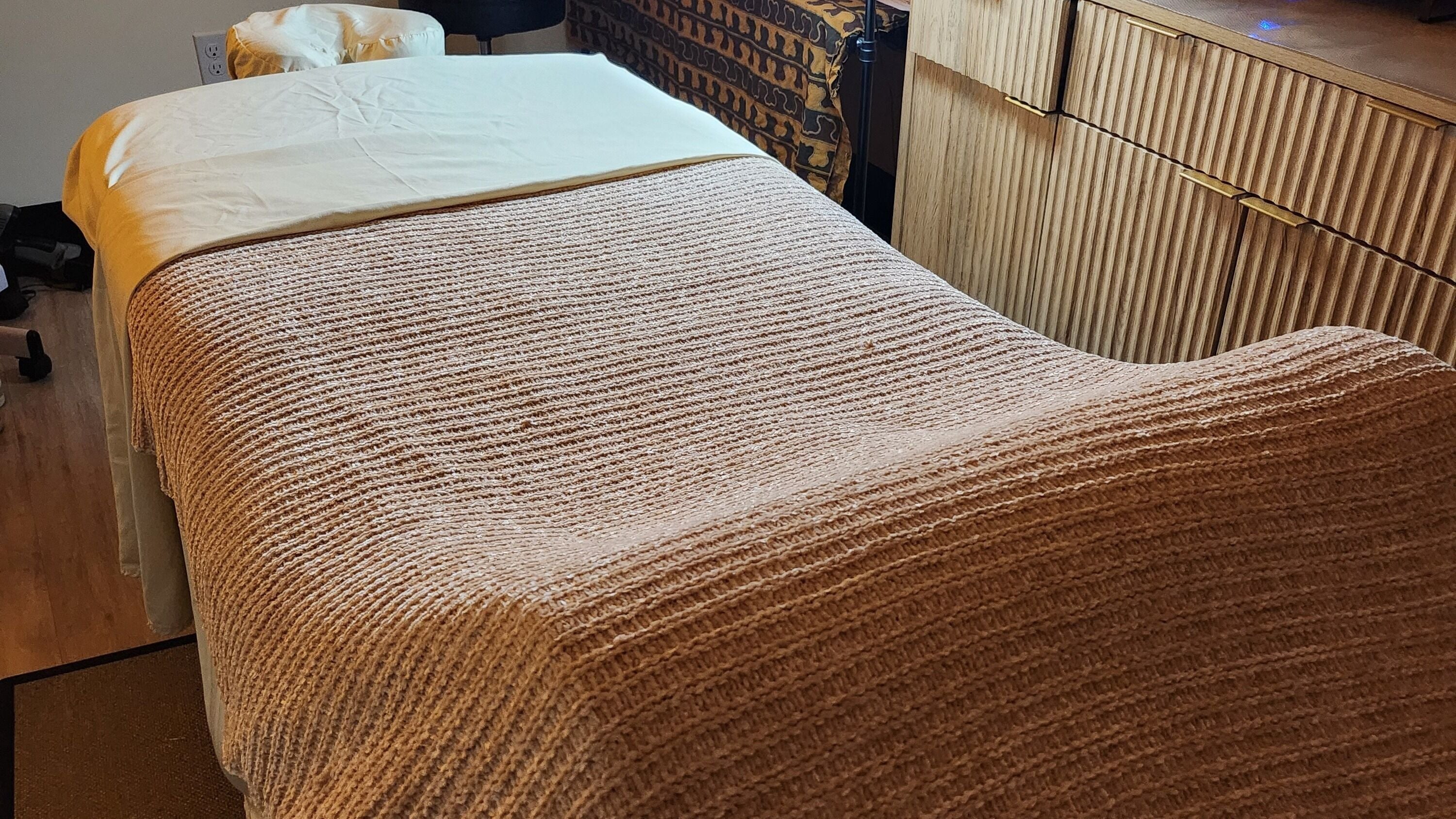 A cozy massage table at The Smooth Suite, Hartsdale, New York, US for ultimate relaxation and comfort.