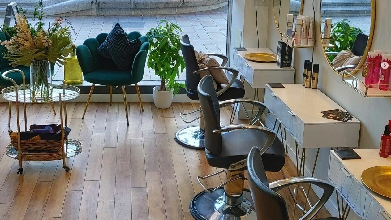 Mark Mardell salon interior with chic decor and styling chairs in Dartford, England, GB.