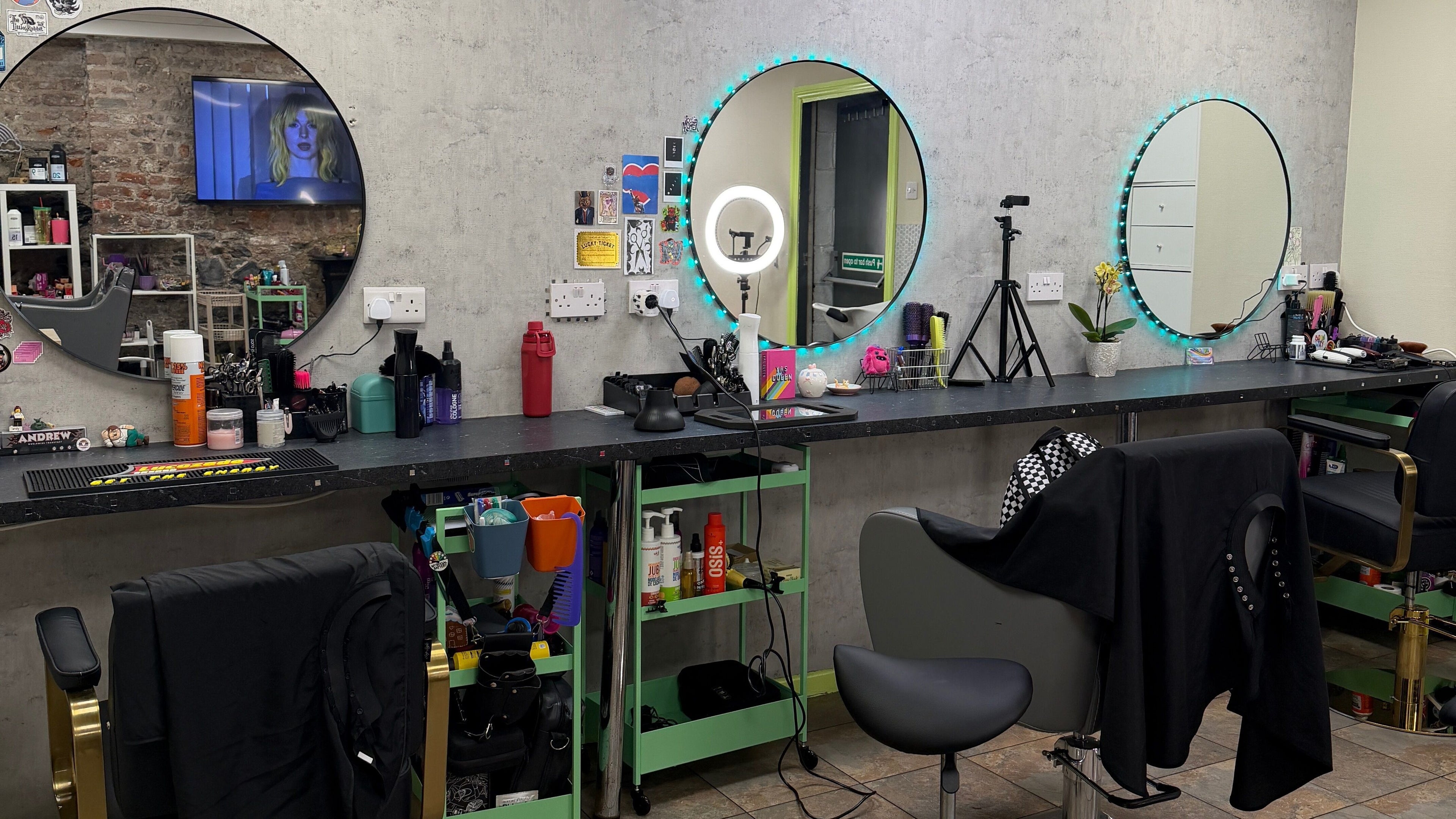 Modern salon stations at Ni Colitti Hair, Dublin. Stylish decor and professional styling tools showcased.