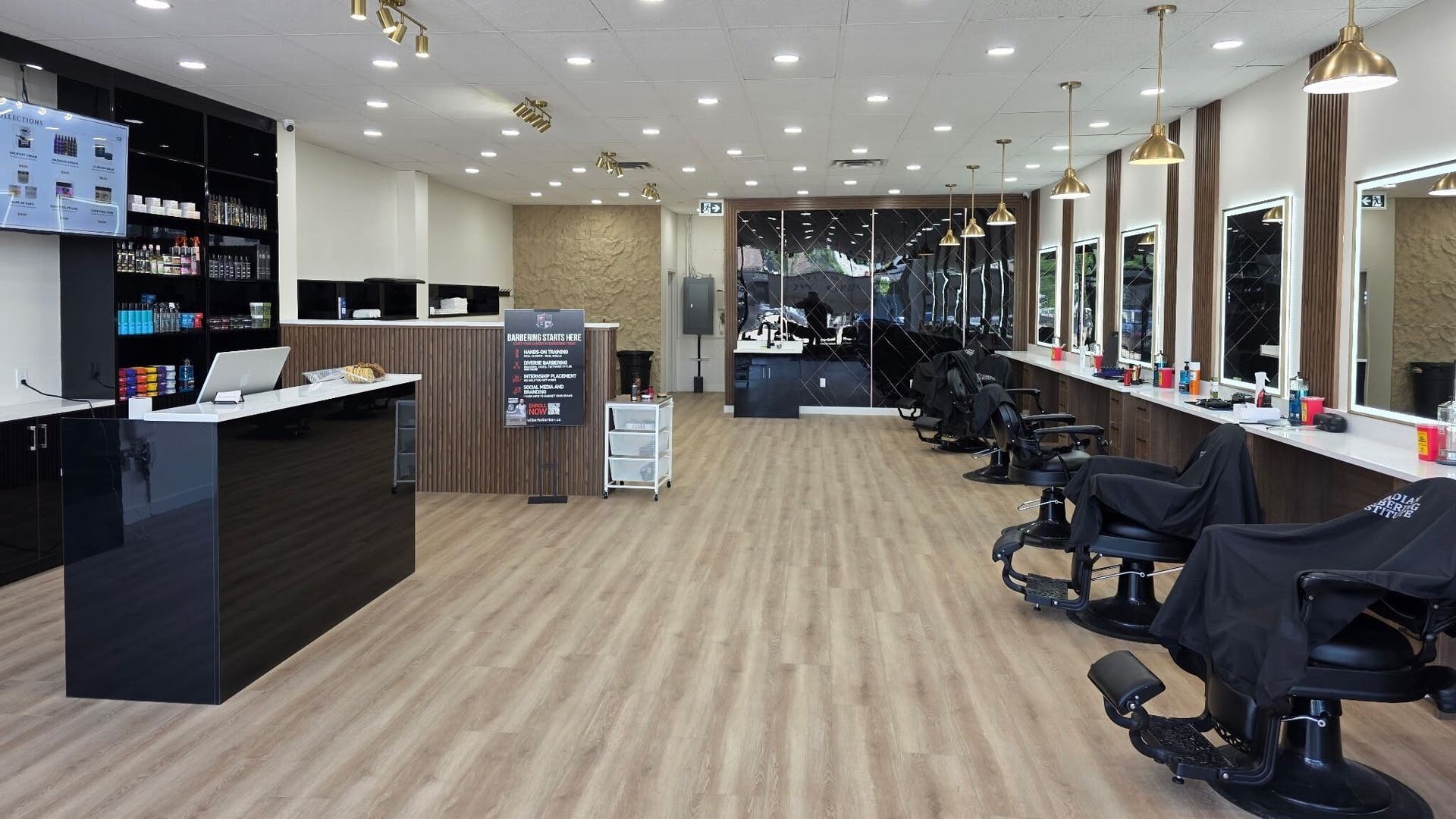 Interior of Gentlemen's Barbershop 124 showcasing sleek chairs and styling stations in Edmonton, Alberta, CA.