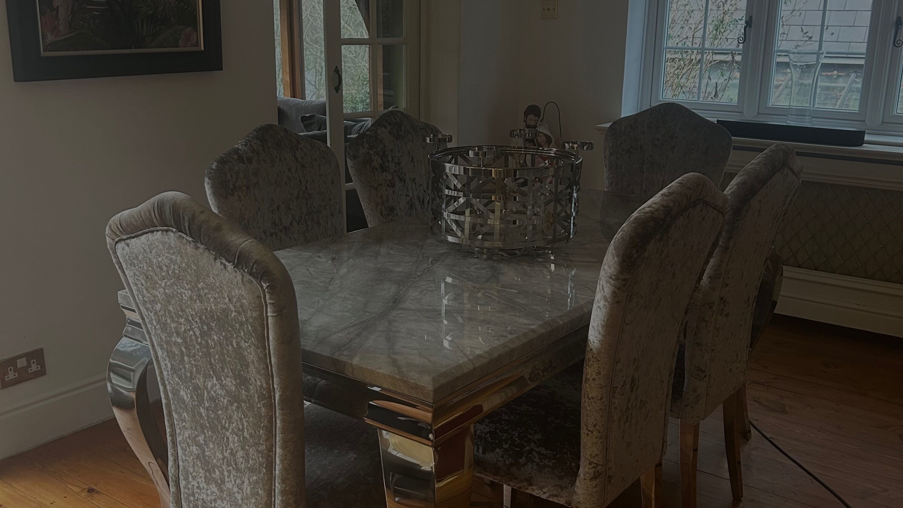 Luxurious dining area at Coastline Collective, Polegate, England, GB with velvet chairs and a marble table.