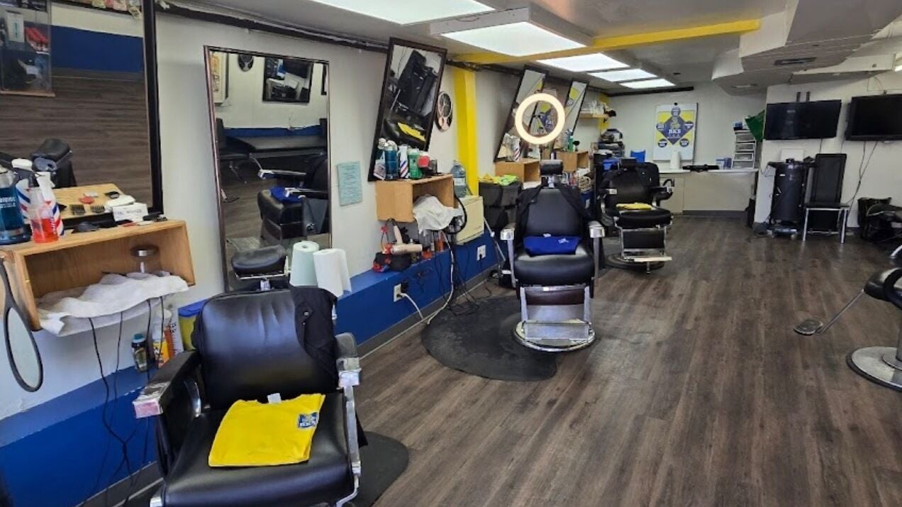 Modern barber chairs at CutemupHuncho, Toronto, Ontario, CA, showcasing a sleek, professional hair styling setup.