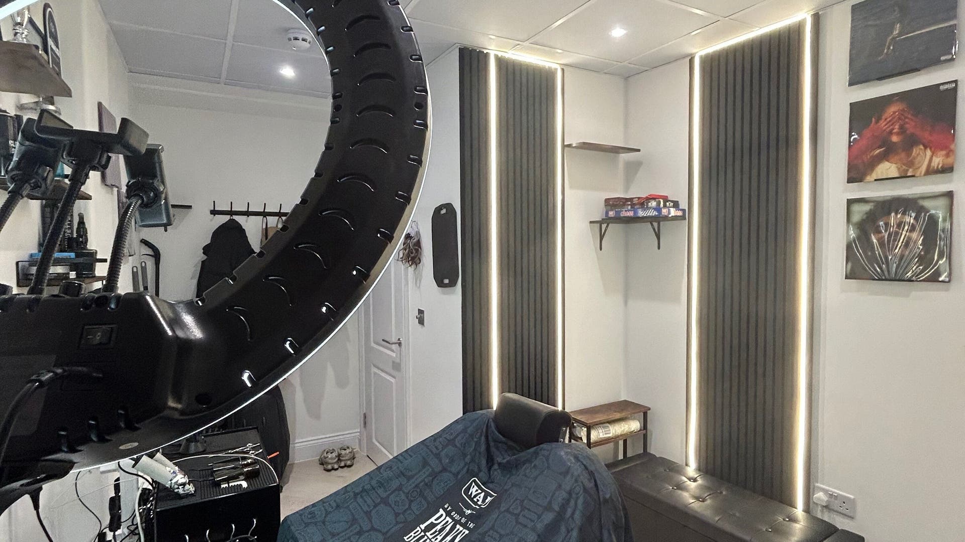 Interior of ACE Men Hair Studio in London, England, GB, featuring sleek lighting and stylish decor.