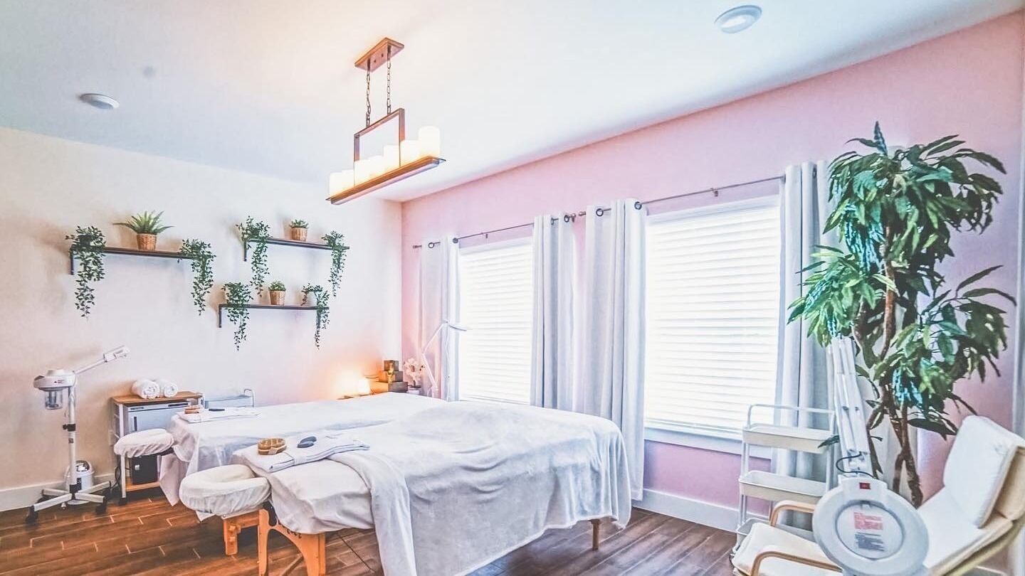 Relaxing treatment room at Energe Spa, Cypress, Texas, US with soothing decor and natural light.