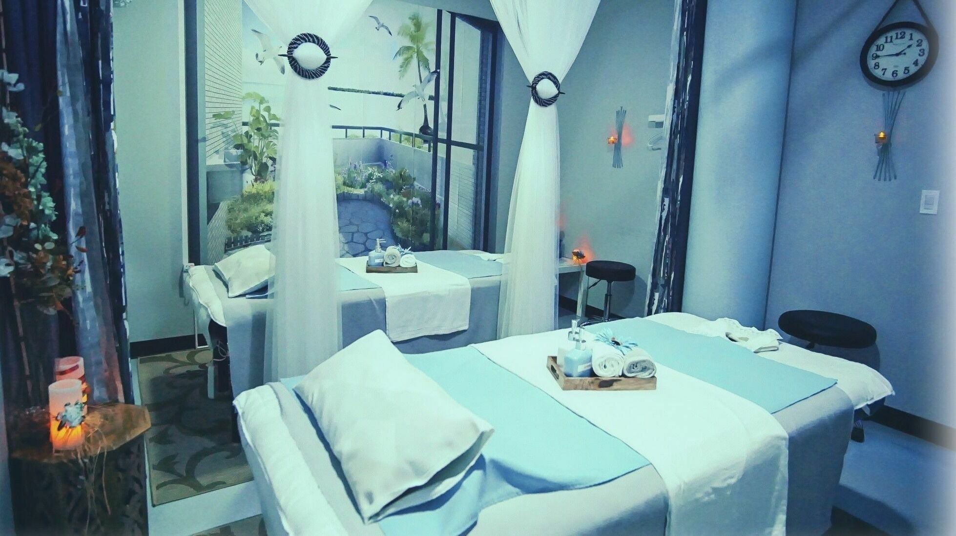Luxurious massage room at Silver Sea Day Spa, San Jose, California, US featuring serene decor and plush treatment beds.