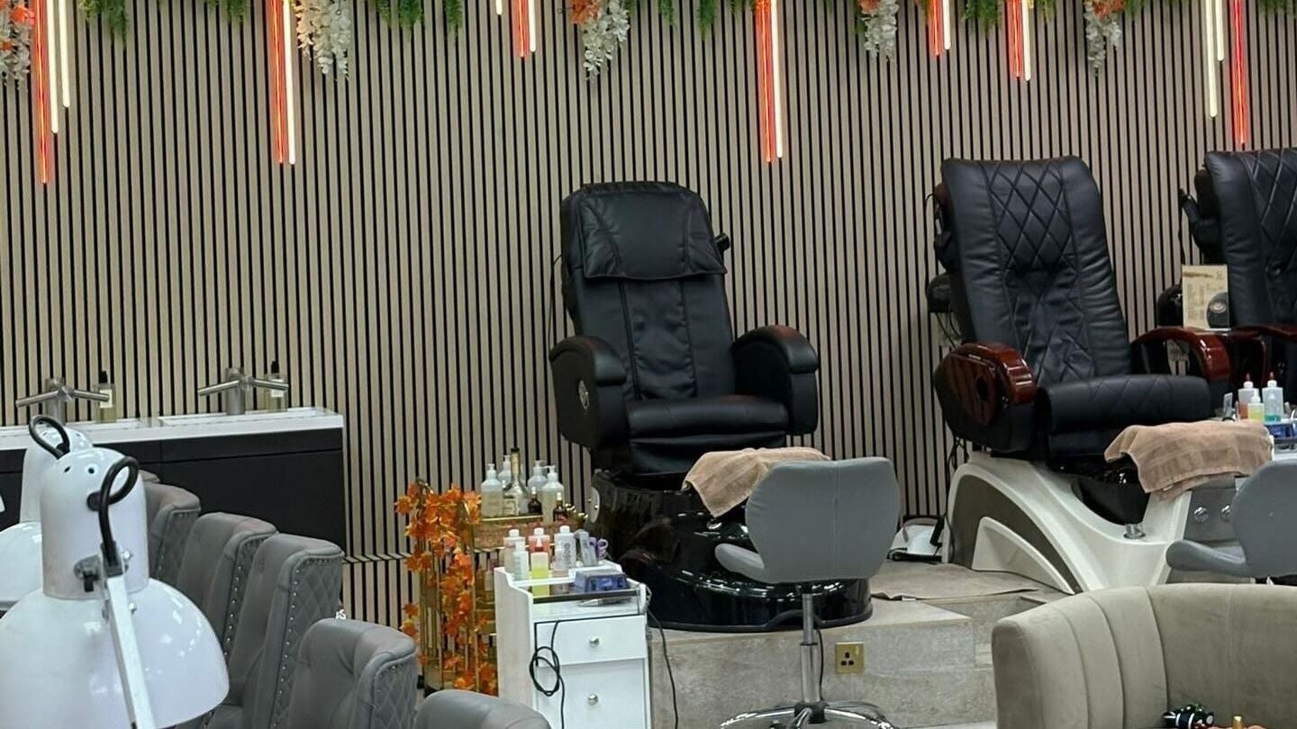 A luxury pedicure area at Get The Gloss, Hamilton, Scotland, GB featuring sleek chairs and modern decor.