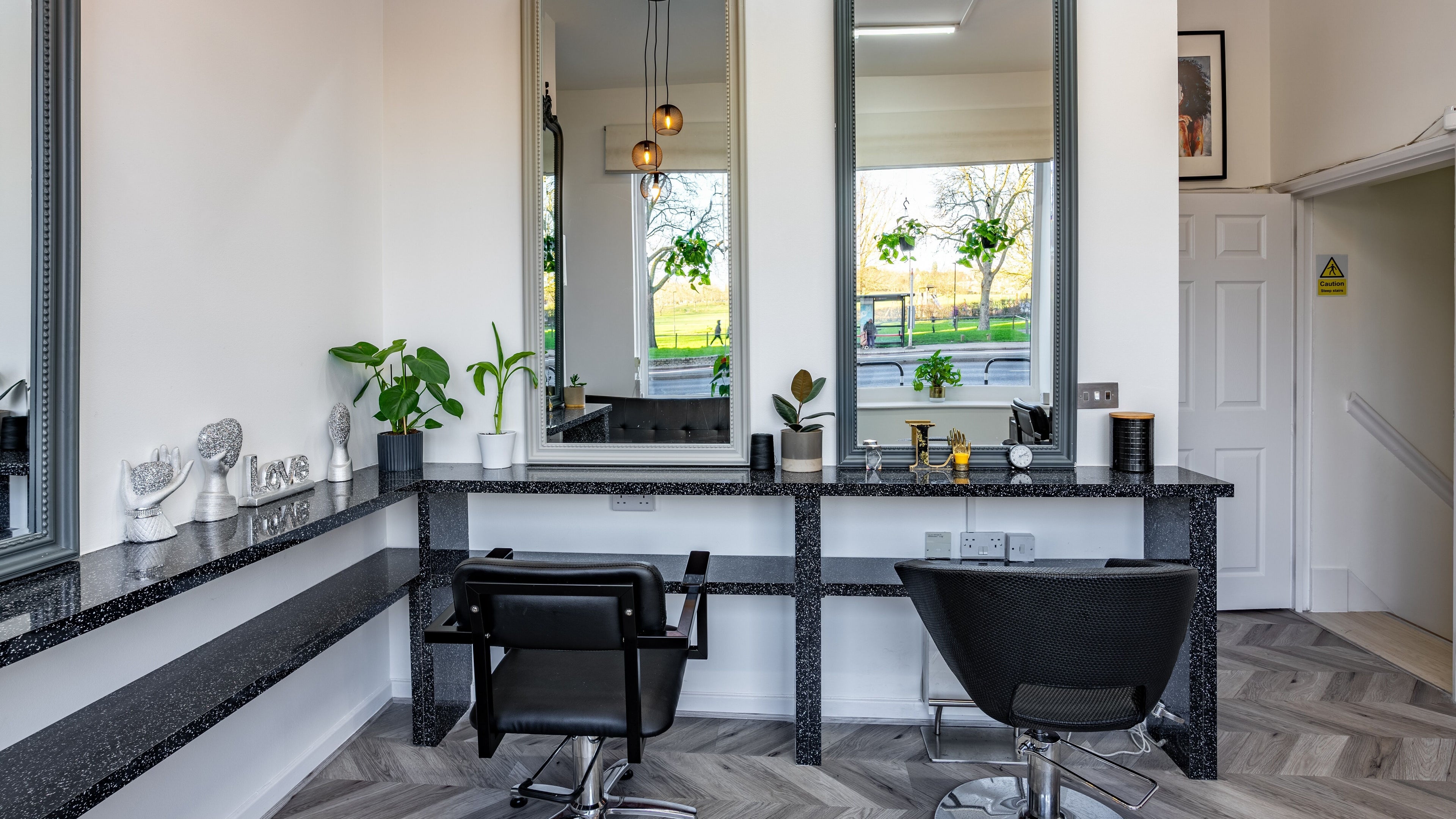 Modern salon interior at Always Natural, London, England, GB with stylish decor and large mirrors.