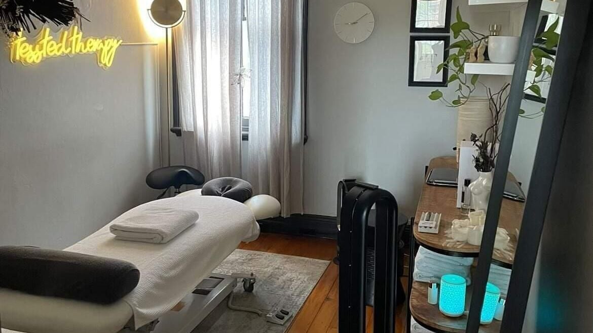 Relaxing therapy room at Tessted Therapy in Alexandria, New South Wales, AU featuring a massage table and ambient decor.