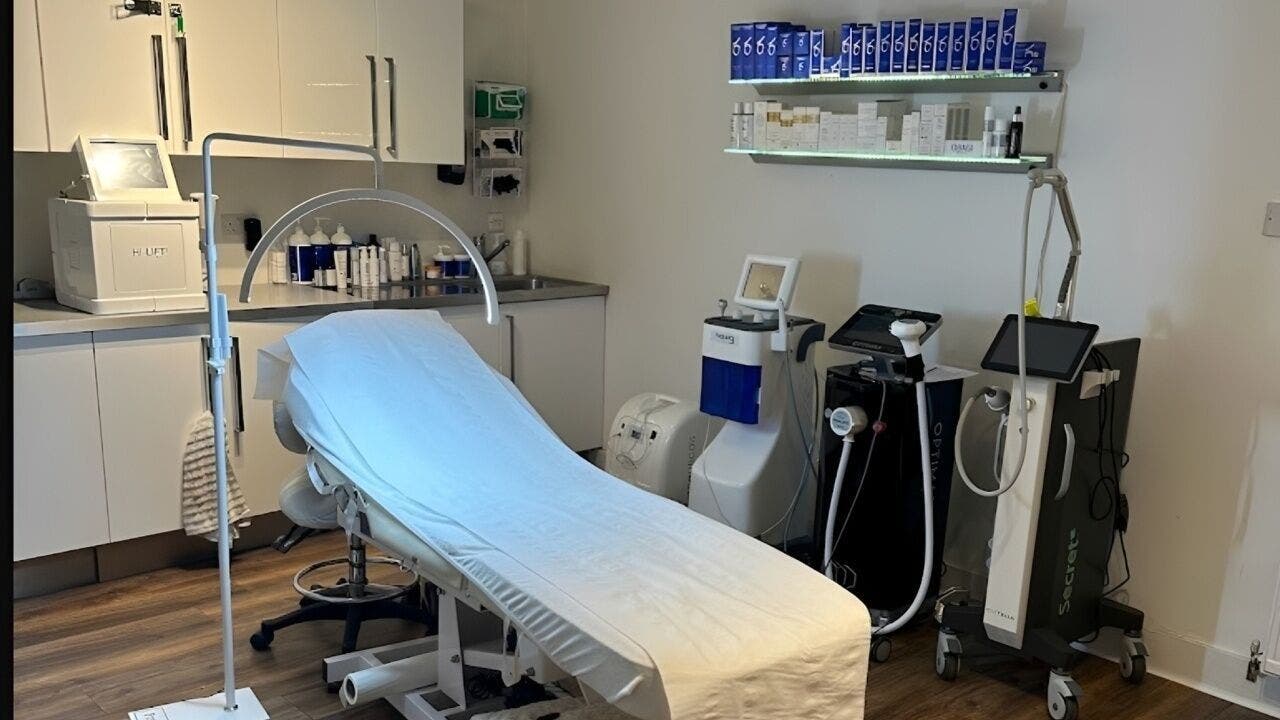 Modern treatment room at Jola Aesthetics in Glasgow, Scotland, GB with advanced aesthetic devices.