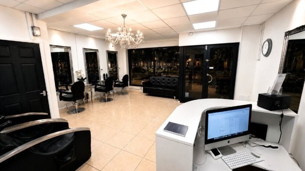 Elegant lounge area of LL Joydens Wood Ltd in Bexley, England, GB featuring modern decor and a computer station.