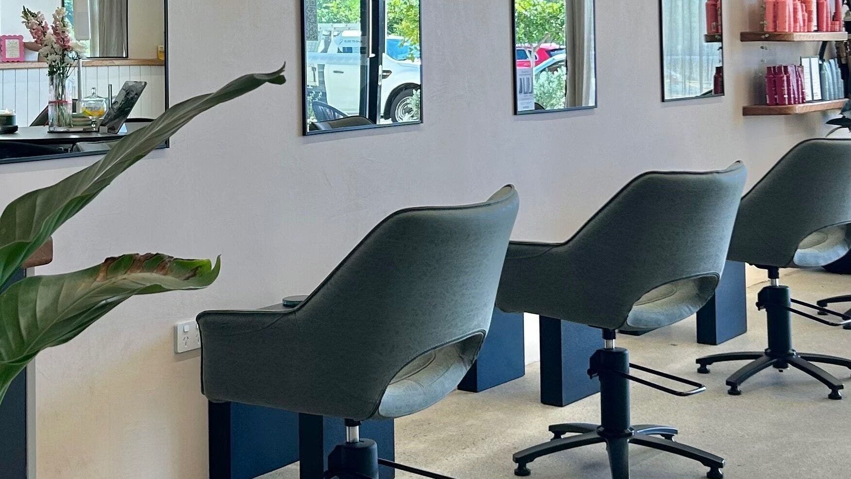 Modern salon chairs at Tame Hair Therapy, Bokarina, Queensland, AU, offering a stylish and relaxing experience.