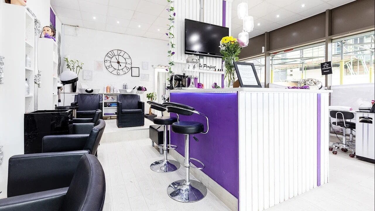 Modern interior of Be Perfect Hair and Beauty Salon, London, England, GB with stylish decor and seating.