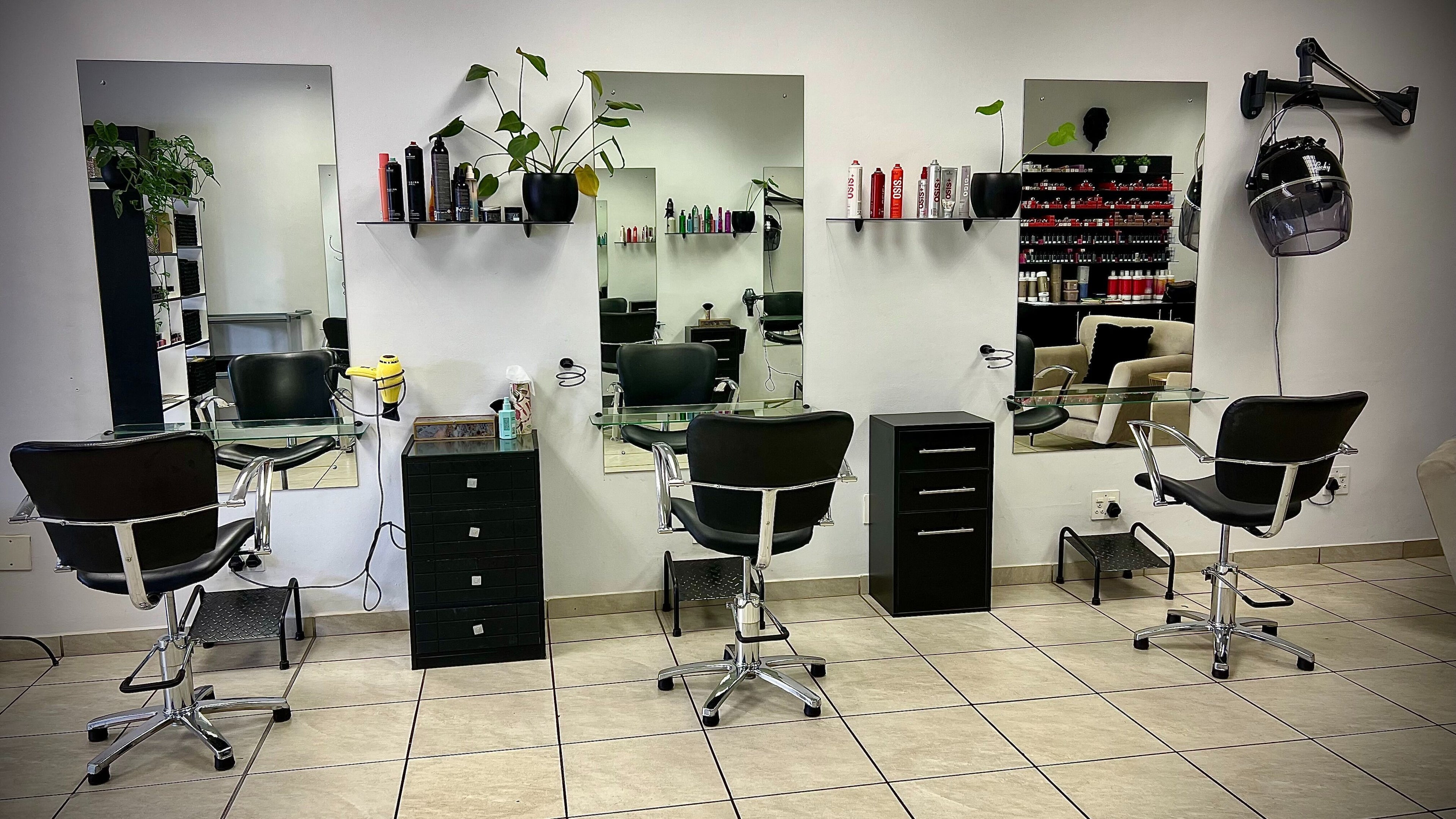 Hey Beautiful Hair Co. salon interior with stylish chairs and mirrors in Pretoria, Gauteng, ZA.