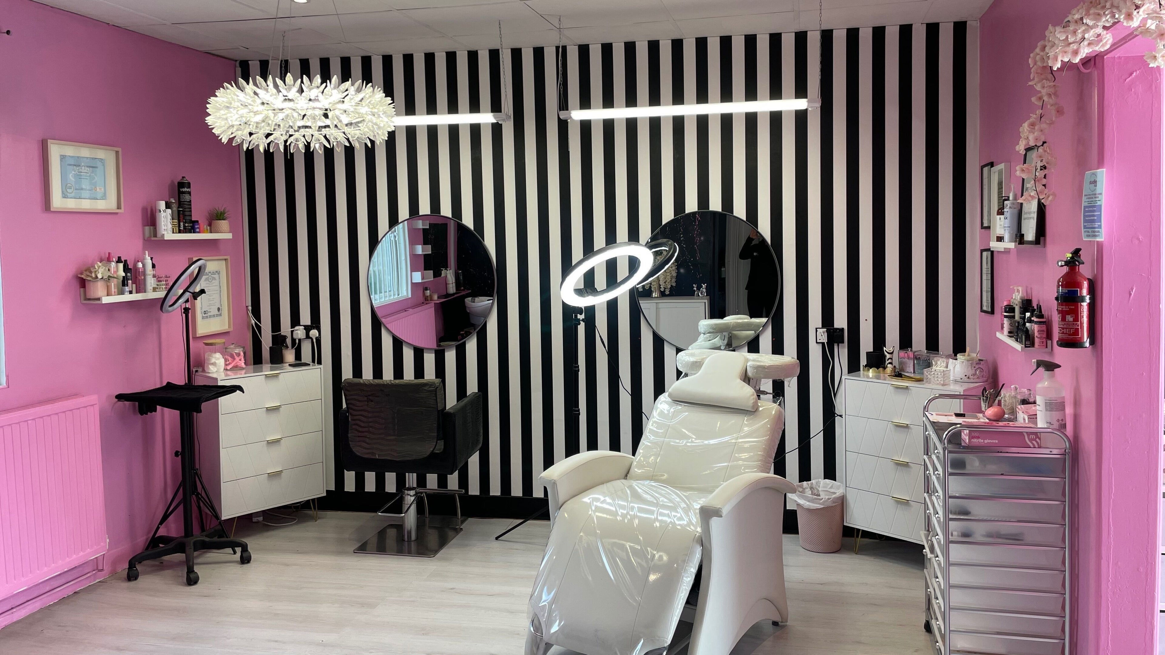 Modern salon at Bloom Nails and Beauty, Rochdale, England, GB with pink walls and stylish decor.
