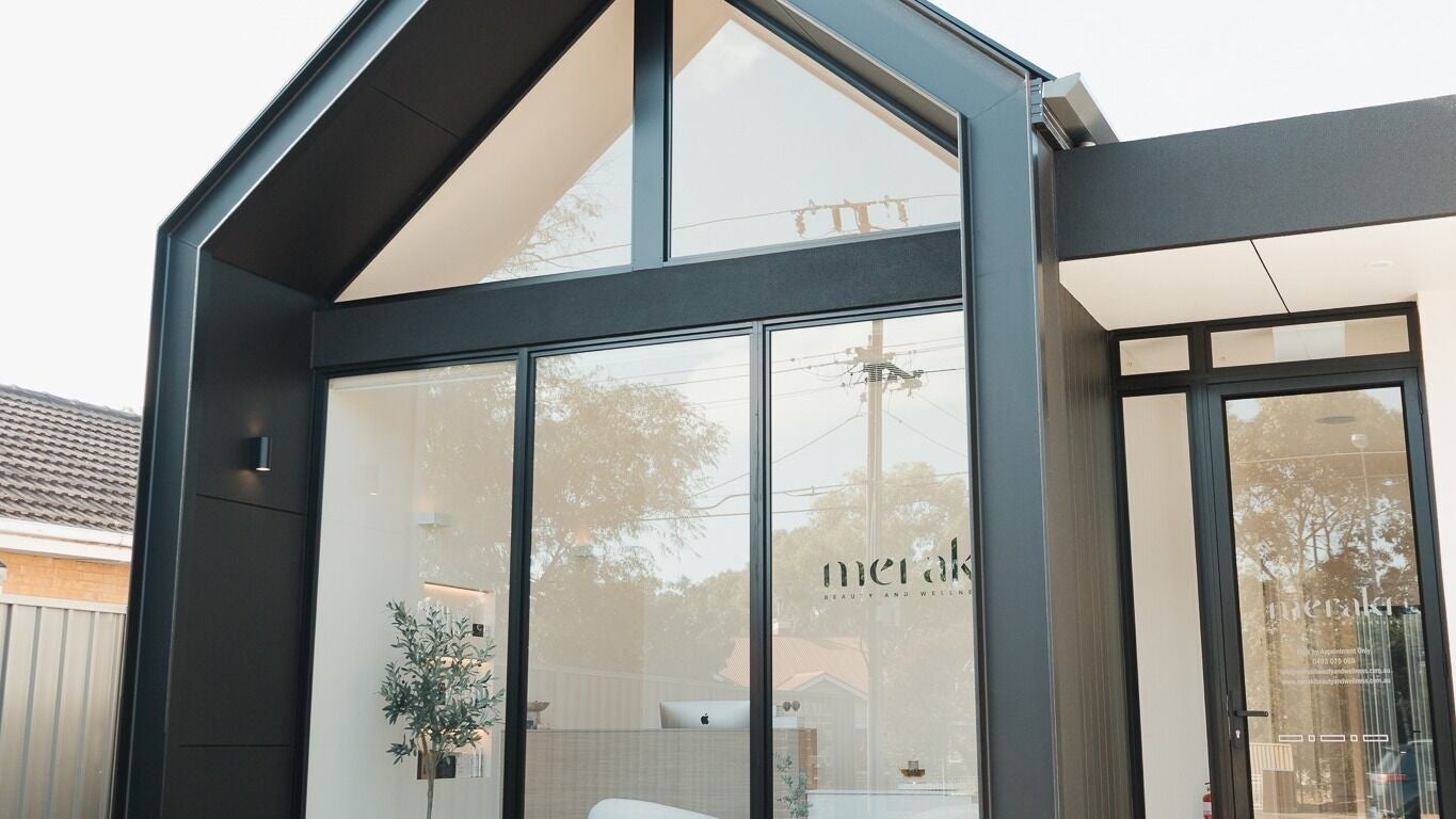 Elegant entrance of Meraki Beauty and Wellness in Paradise, South Australia, AU with modern glass design.
