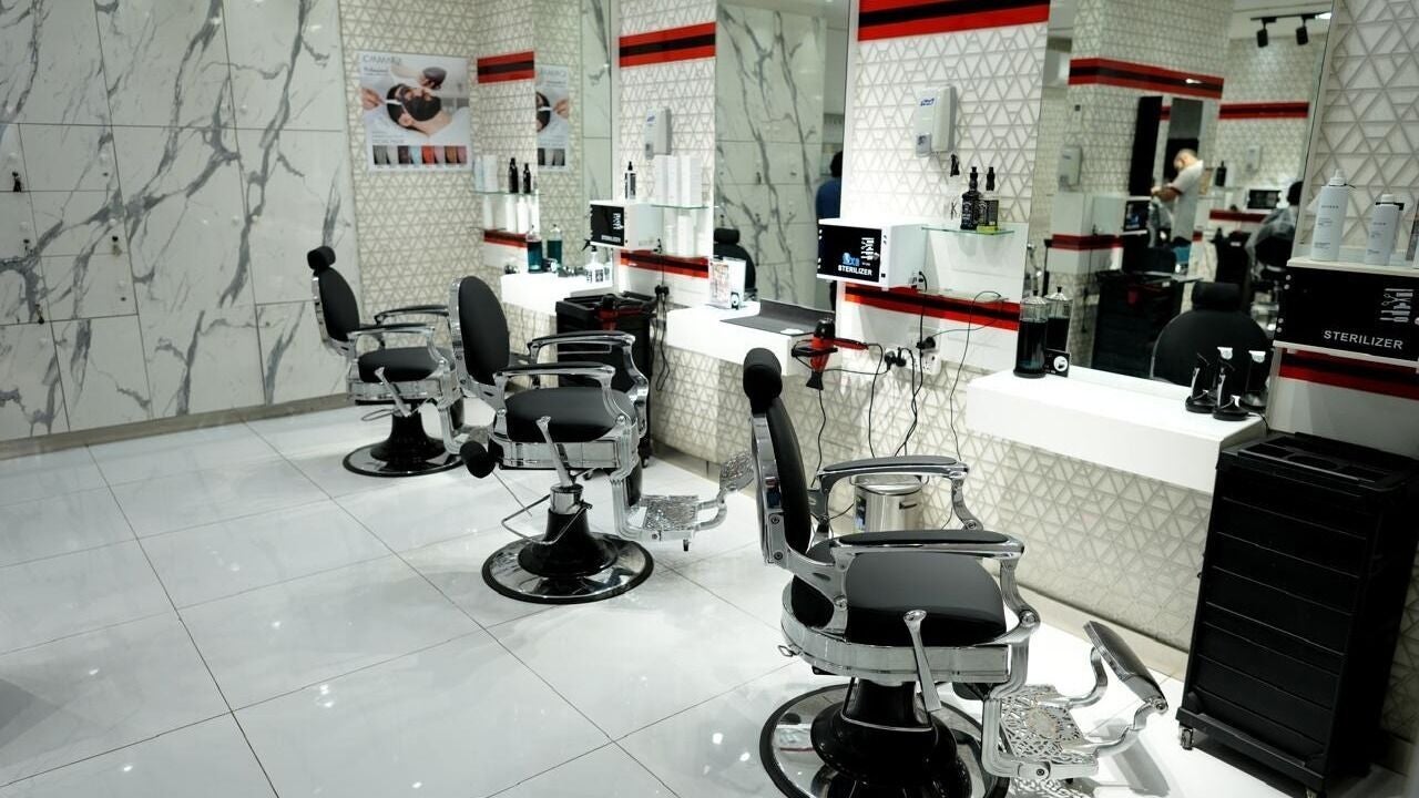 Modern barber chairs at Quality Fix Gents Salon | Al Nahda 1 in Dubai, AE, offering stylish grooming services.