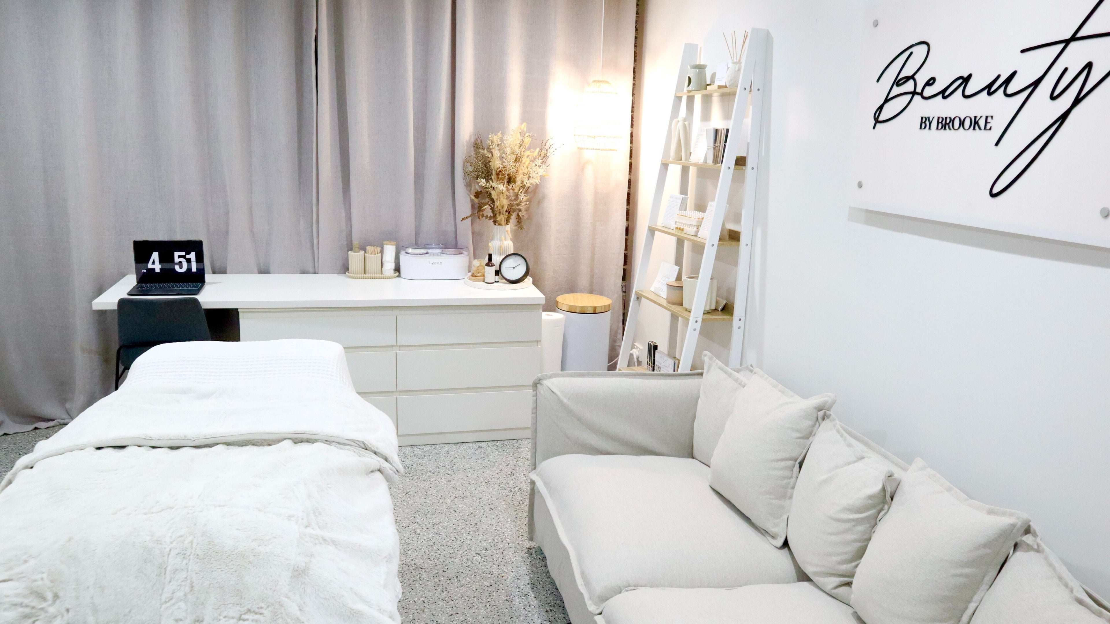Spa treatment room at Beauty by Brooke, Melbourne, Victoria, AU featuring soothing decor and plush seating.