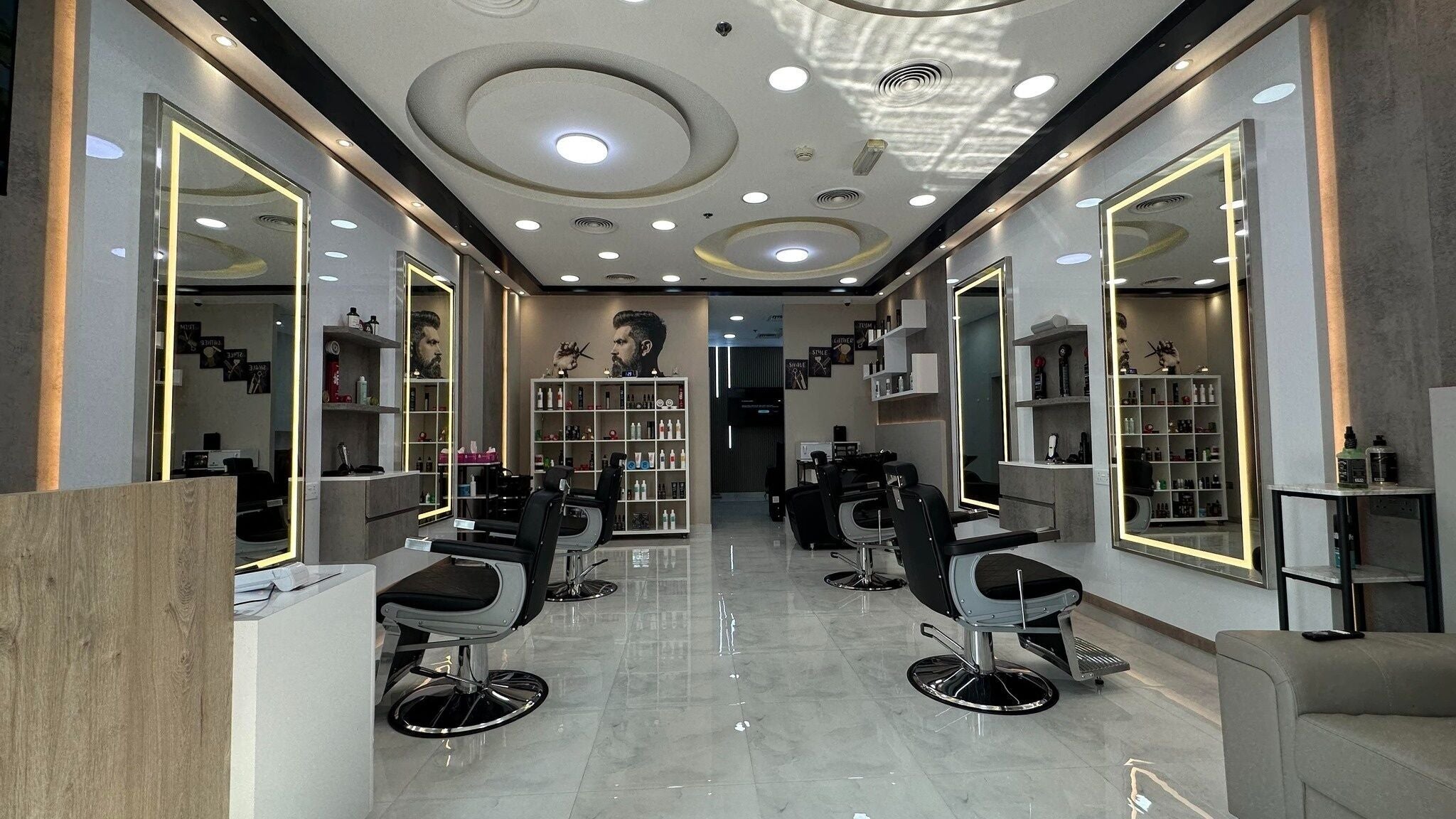 Modern interior of Aleph Gents Salon DMCC, featuring stylish mirrors and chairs, located in Dubai, AE.