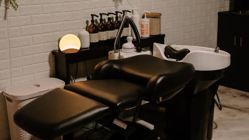 Luxurious headspa chair at Root Rituals Salon Headspa & Wellness in Webster, New York, US designed for relaxation.