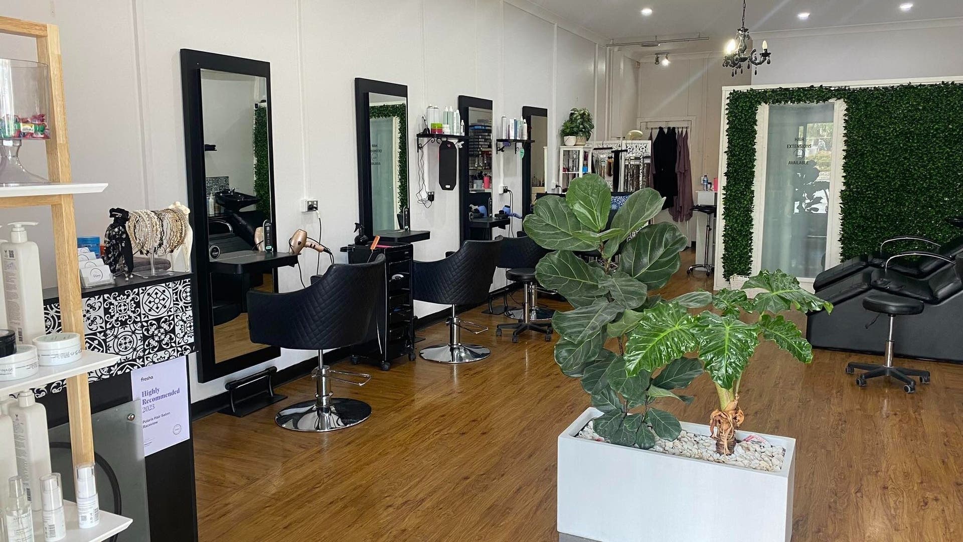 Modern styling chairs at Lilora Hair Studio, Raceview, Queensland, AU, featuring chic decor and vibrant plants.