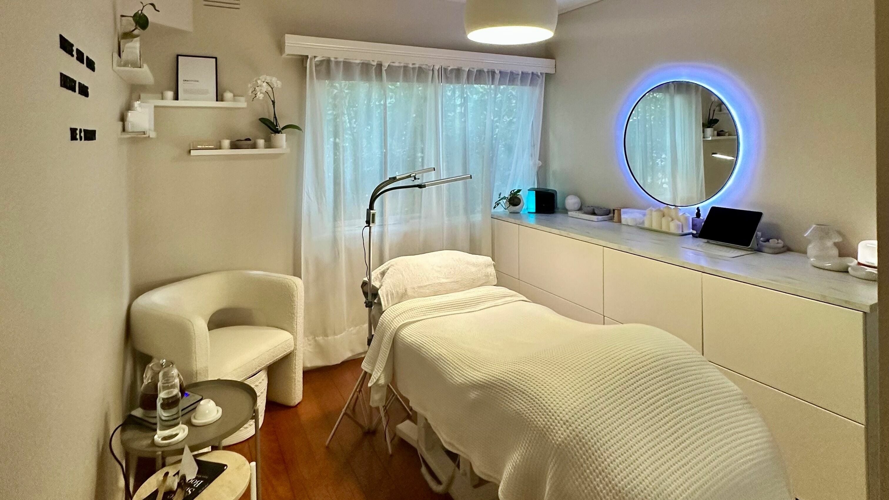 Relaxing therapy room at The C Therapy in Melbourne, Victoria, AU with a plush bed and serene decor.