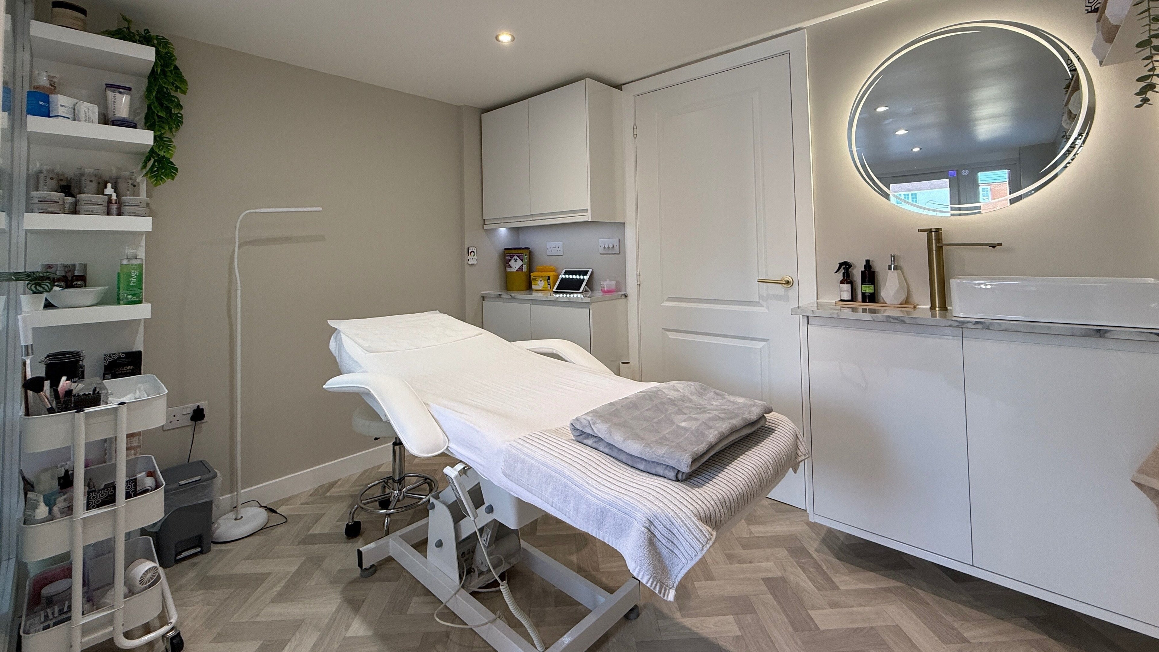 Elegant treatment room at Plush Beauty Box, Exeter, England, GB, featuring a modern spa bed and sleek decor.
