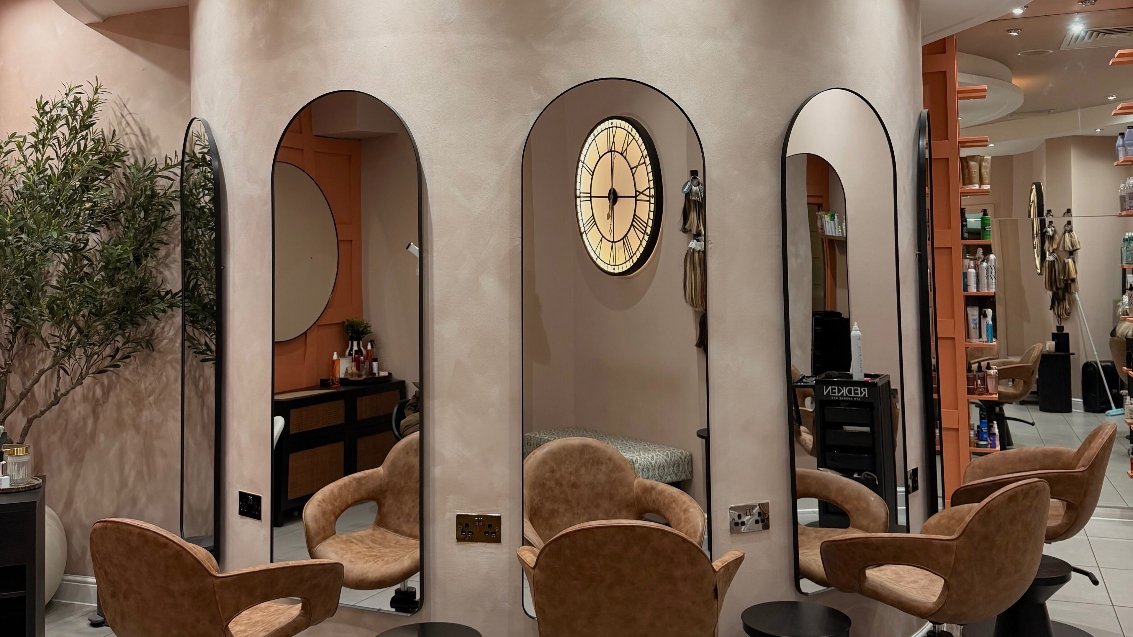 Chic interior of Element Hair Lounge in Hamilton, Scotland, GB, showcasing stylish chairs and mirrors.