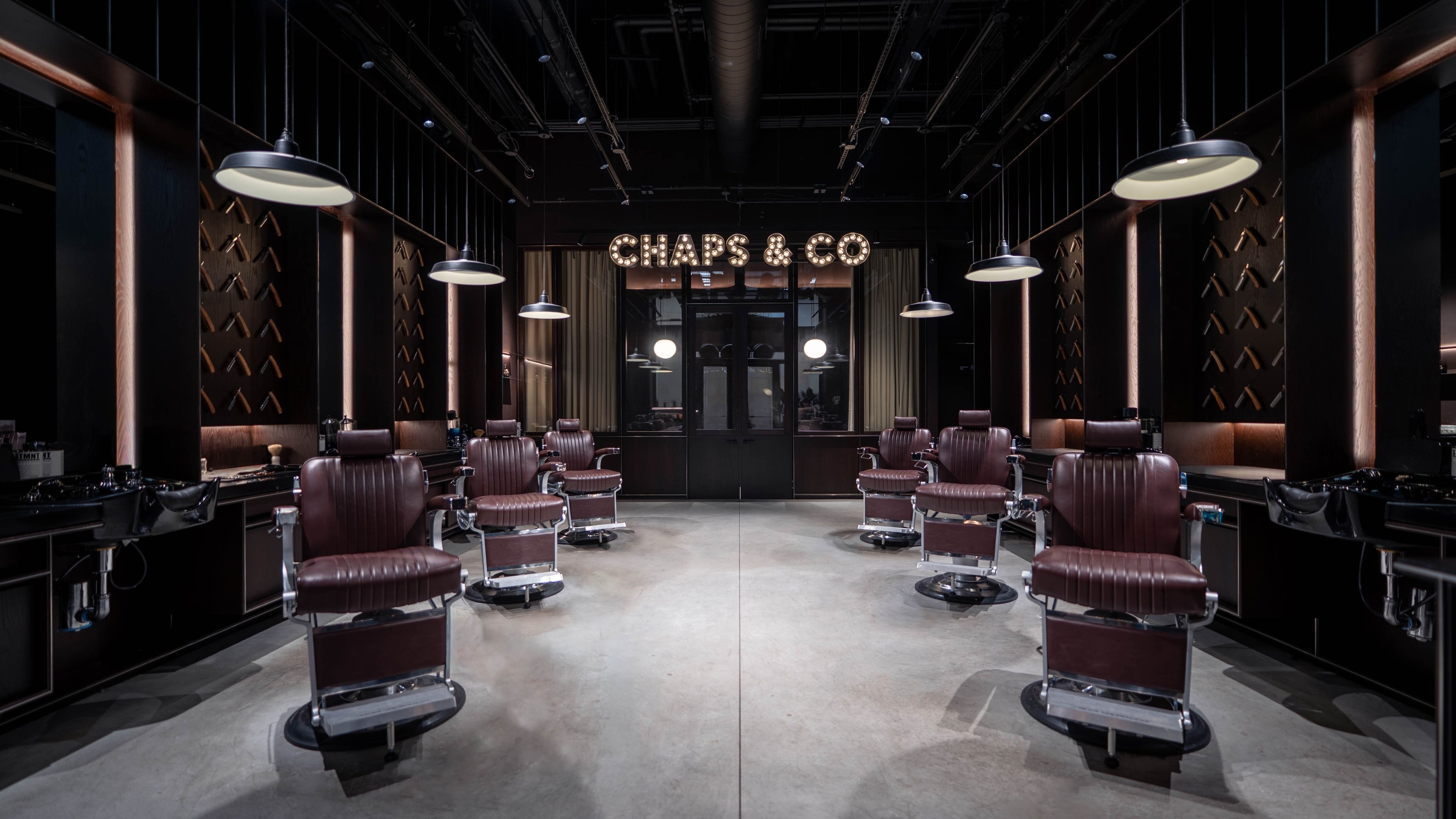 Luxurious barber chairs at Grand Central, New York, New York, US, offering premium wellness services.