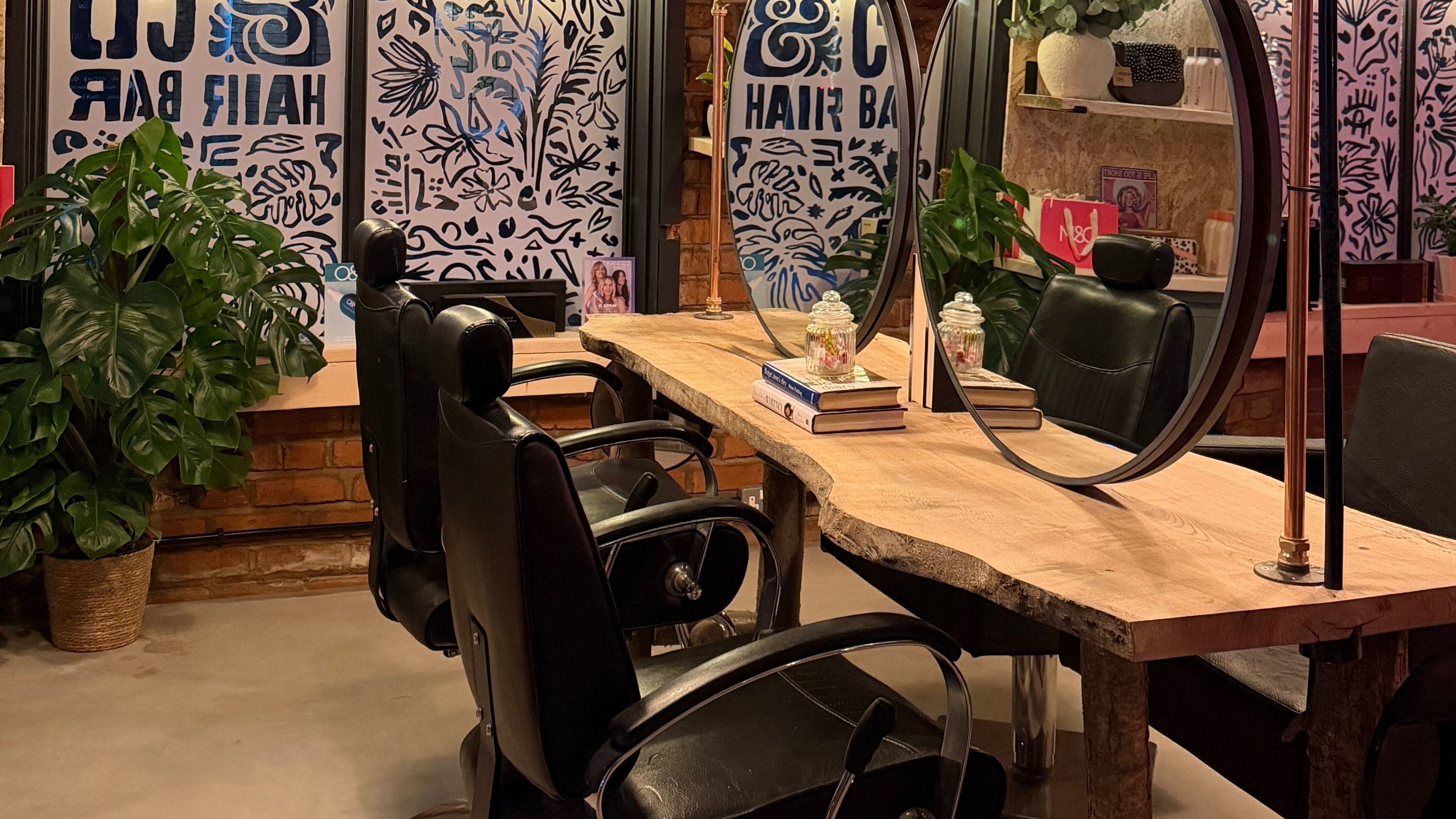 Elegant interior of Dawn & Co Hair Bar Conwy, featuring sleek chairs and stylish decor, Conwy, Wales, GB.
